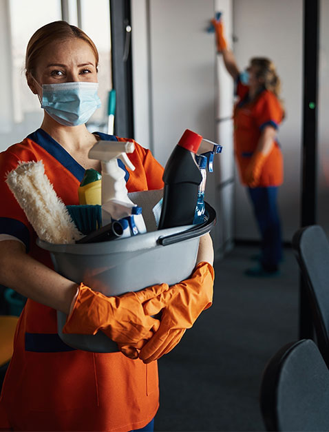 Women cleaning and providing janitorial services for a commercial office space.